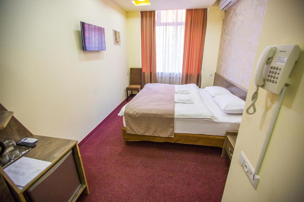 Postel nebo postele na pokoji v ubytování Hobby Hotel