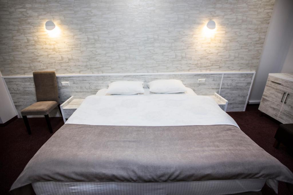 Postel nebo postele na pokoji v ubytování Hobby Hotel