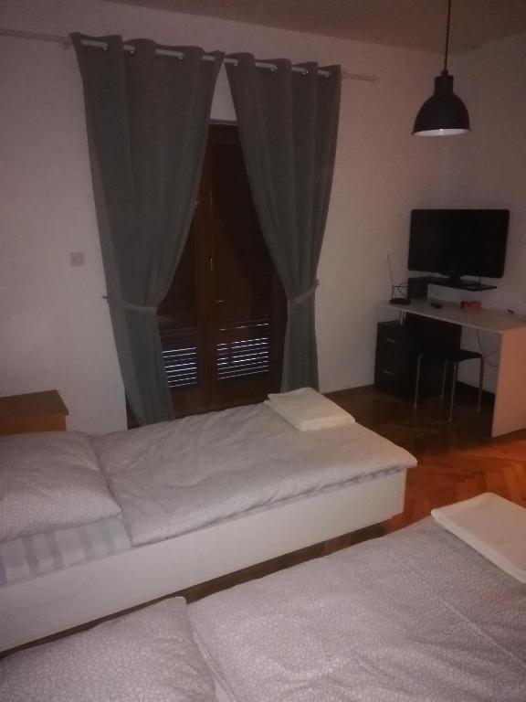 Postel nebo postele na pokoji v ubytování Apartmani Marin