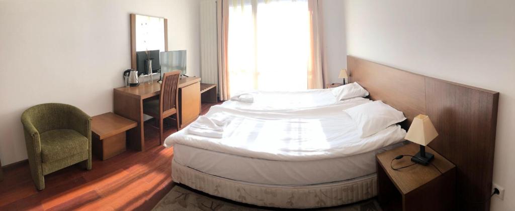Postel nebo postele na pokoji v ubytování Bellevue Residence Apartments