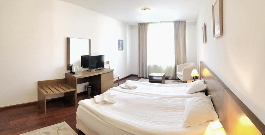 Postel nebo postele na pokoji v ubytování Bellevue Residence Apartments