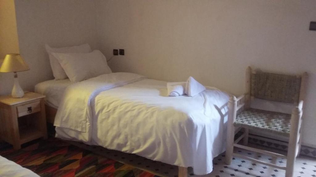 Postel nebo postele na pokoji v ubytování Dar Ait Bouguemez