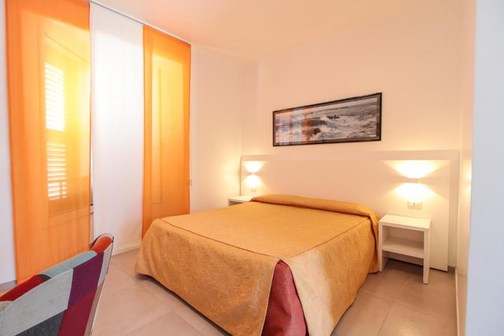Posteľ alebo postele v izbe v ubytovaní Hotel Il Faro Della Guitgia Tommasino
