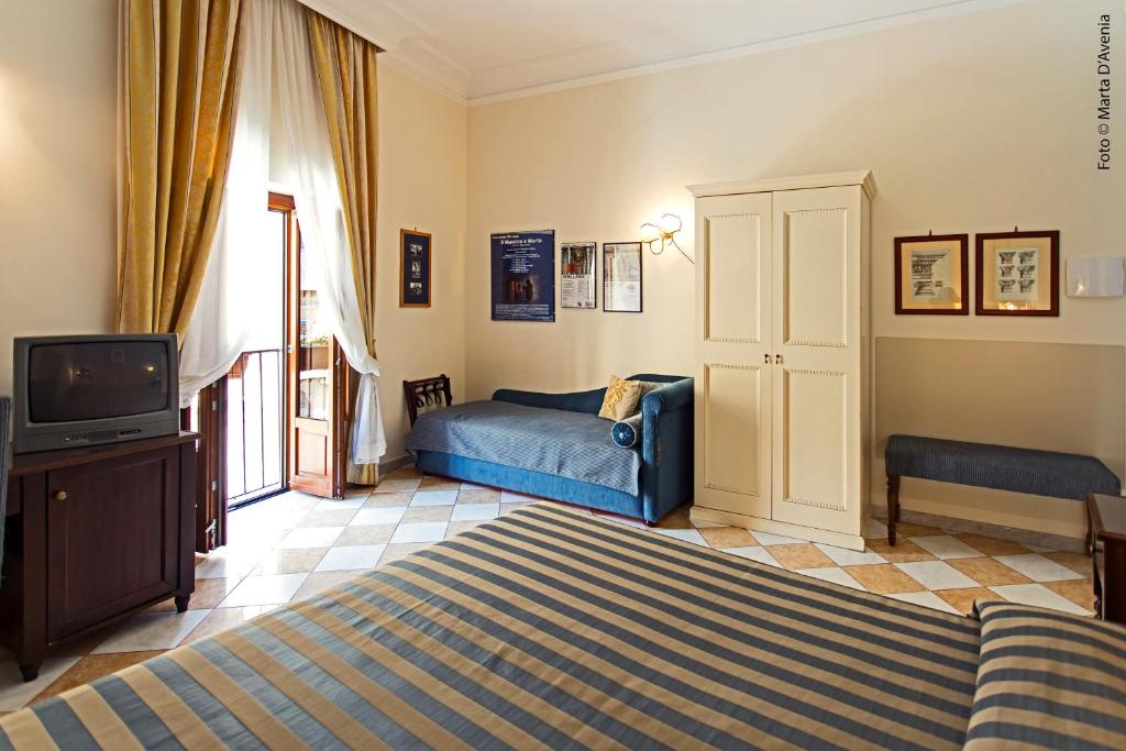 A bed or beds in a room at terrazze di montelusa