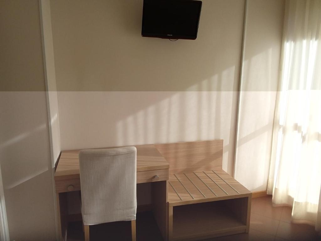 TV a/nebo společenská místnost v ubytování Albergo Nyers