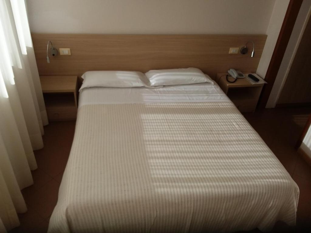 Postel nebo postele na pokoji v ubytování Albergo Nyers