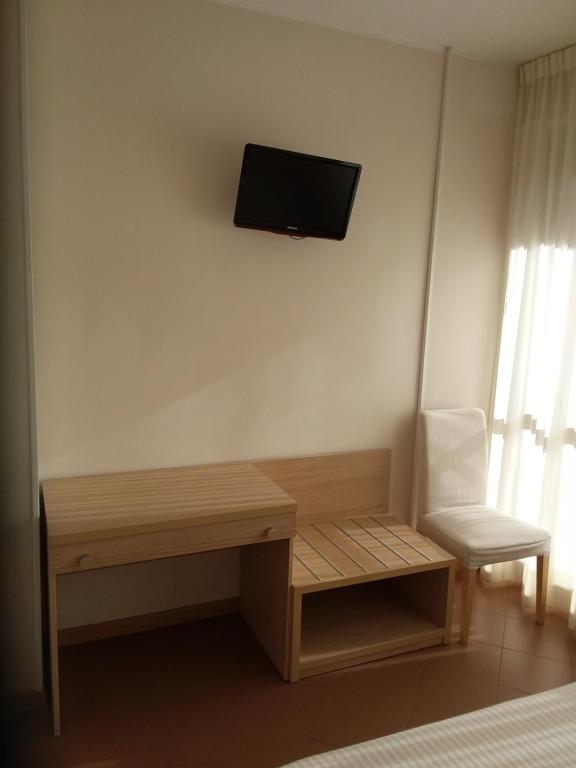 TV a/nebo společenská místnost v ubytování Albergo Nyers