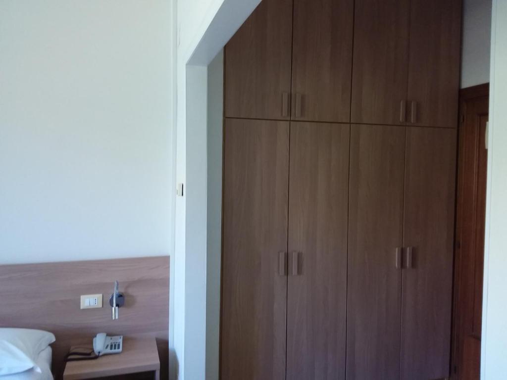 Postel nebo postele na pokoji v ubytování Albergo Nyers