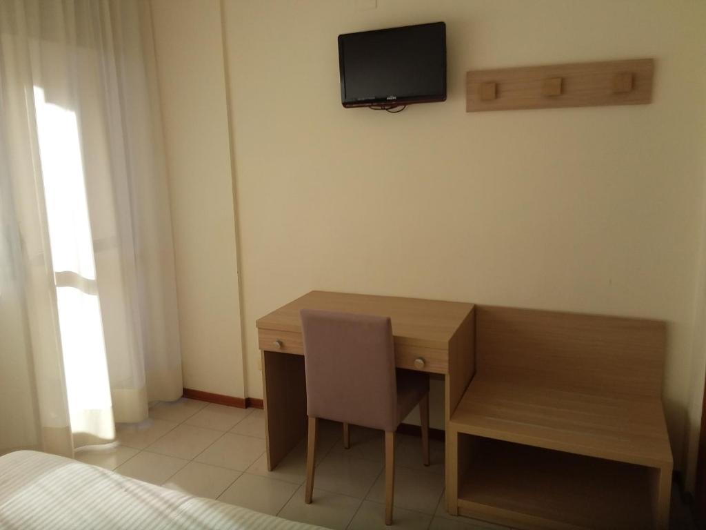 TV a/nebo společenská místnost v ubytování Albergo Nyers