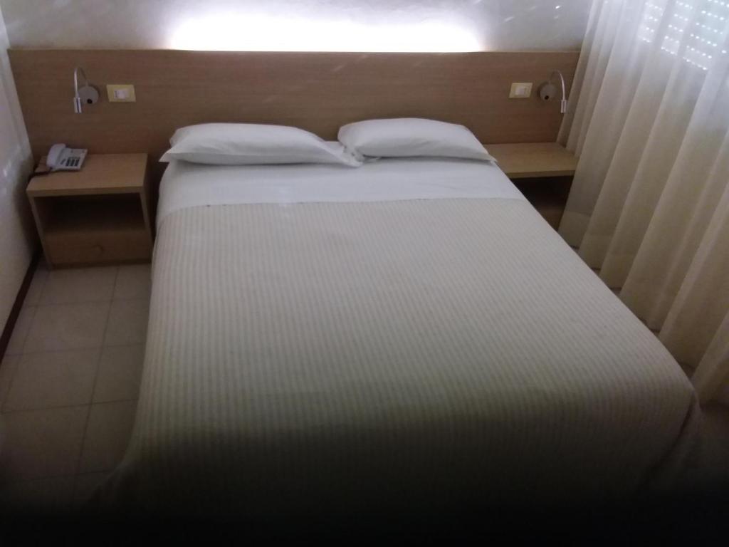 Postel nebo postele na pokoji v ubytování Albergo Nyers