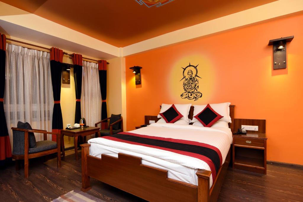 Postel nebo postele na pokoji v ubytování Karma Boutique Hotel