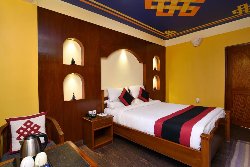 Postel nebo postele na pokoji v ubytování Karma Boutique Hotel