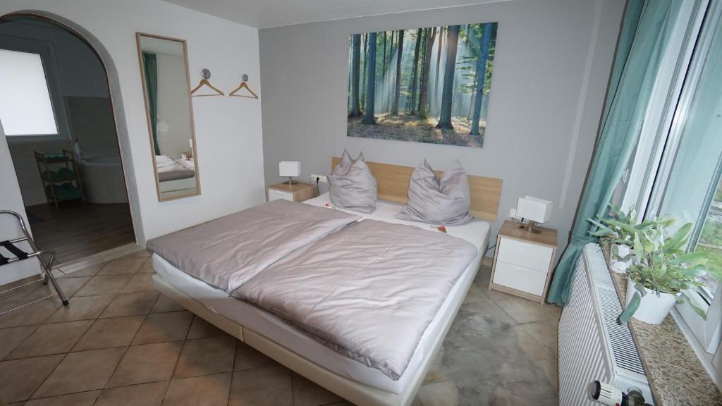 Postel nebo postele na pokoji v ubytování Ferienhaus am Rehberg