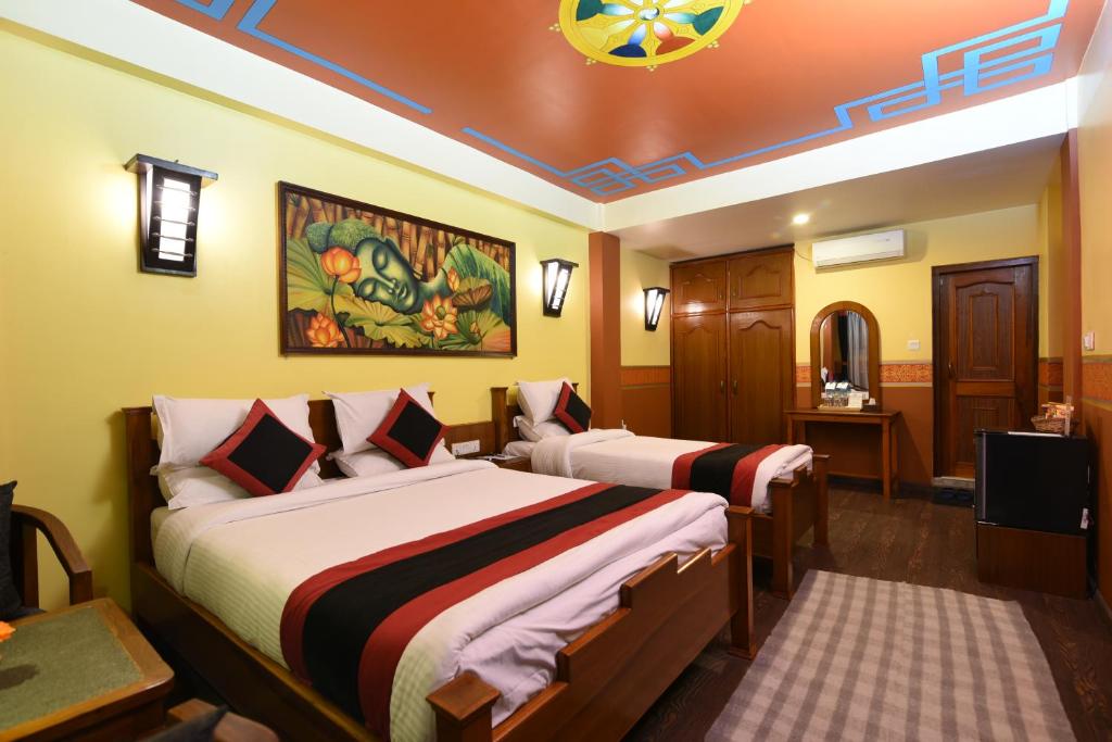 Postel nebo postele na pokoji v ubytování Karma Boutique Hotel