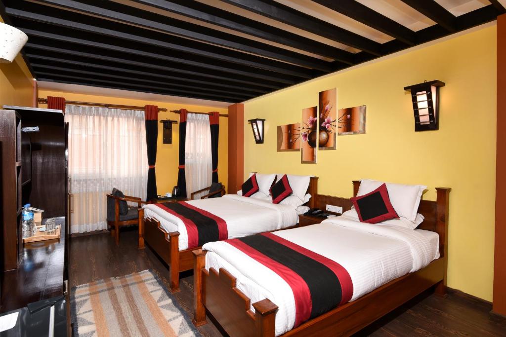 Postel nebo postele na pokoji v ubytování Karma Boutique Hotel