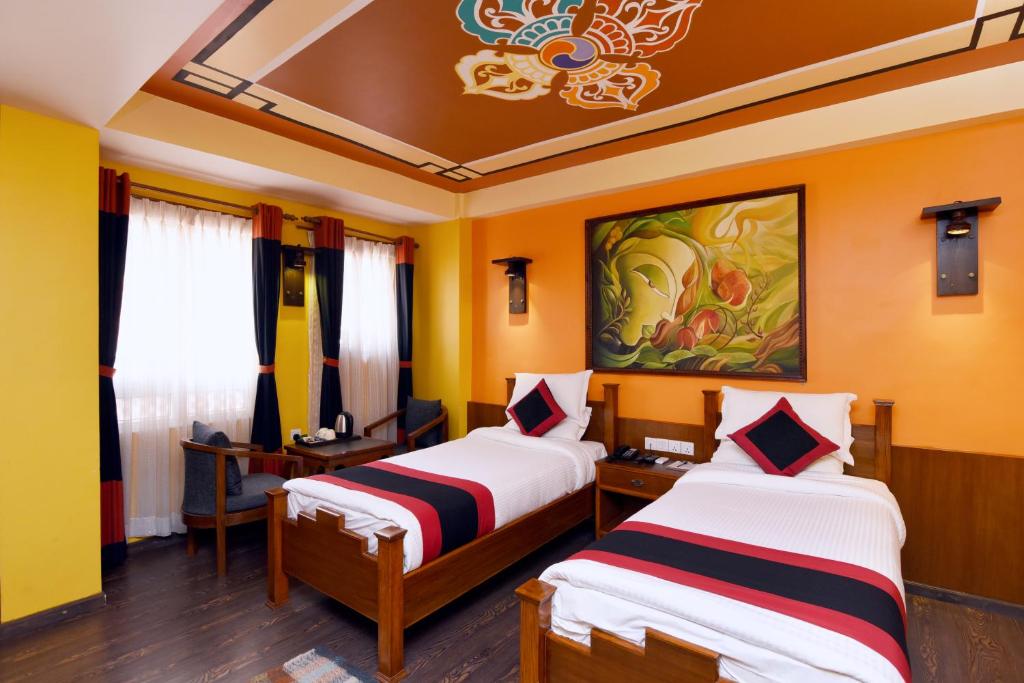 Postel nebo postele na pokoji v ubytování Karma Boutique Hotel