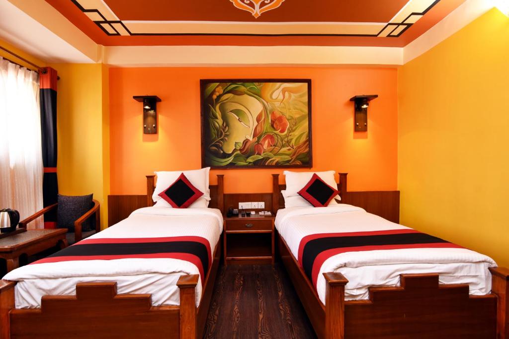 Postel nebo postele na pokoji v ubytování Karma Boutique Hotel