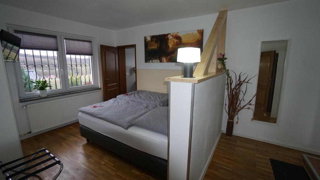 Postel nebo postele na pokoji v ubytování Ferienhaus am Rehberg