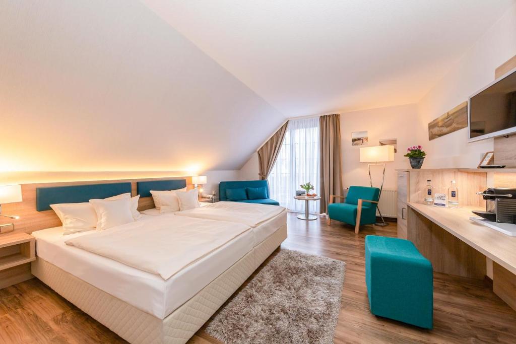 Postel nebo postele na pokoji v ubytování Hotel Blinkfüer