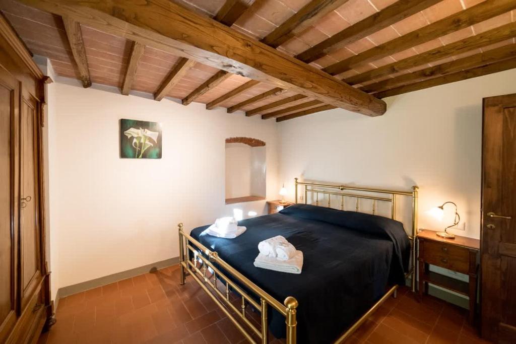 Postel nebo postele na pokoji v ubytování Borgo Macereto