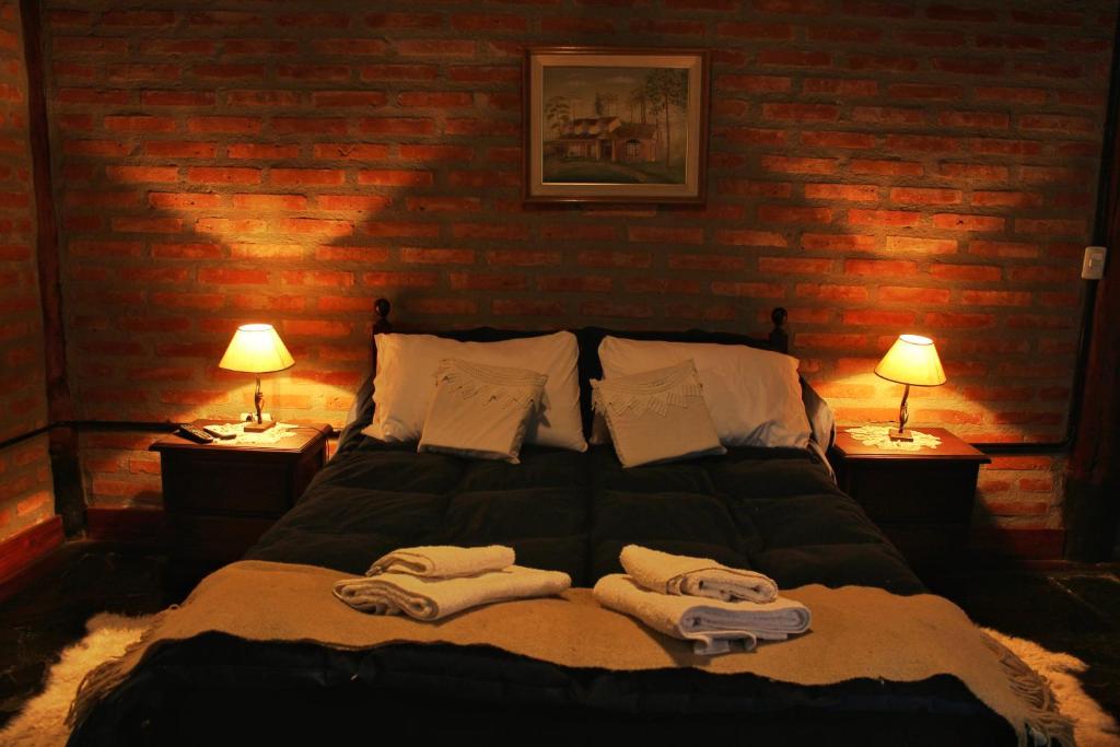 Voodi või voodid majutusasutuse Criollo Lodge toas