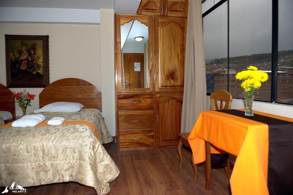 Postel nebo postele na pokoji v ubytování Hotel Melanys