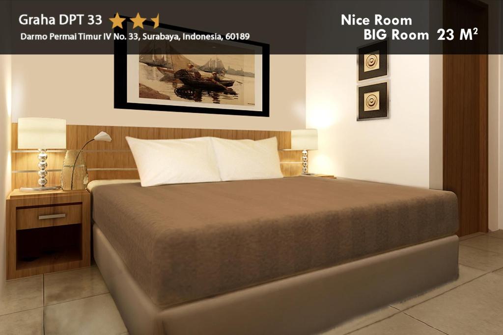 Postel nebo postele na pokoji v ubytování Hotel Graha DPT 33