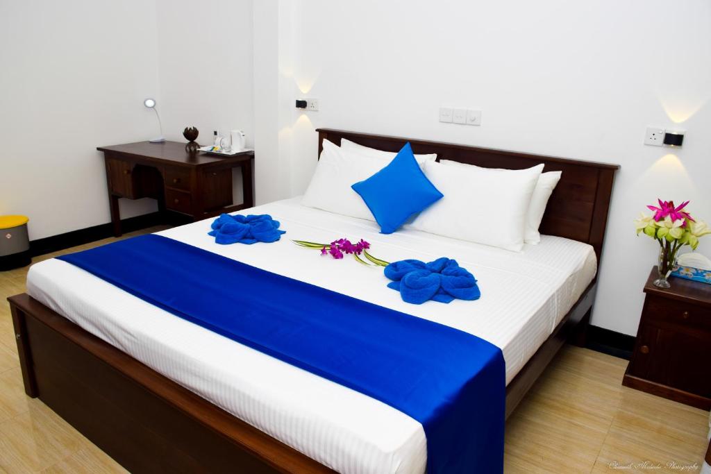 Postel nebo postele na pokoji v ubytování Tenasi Beach Resort