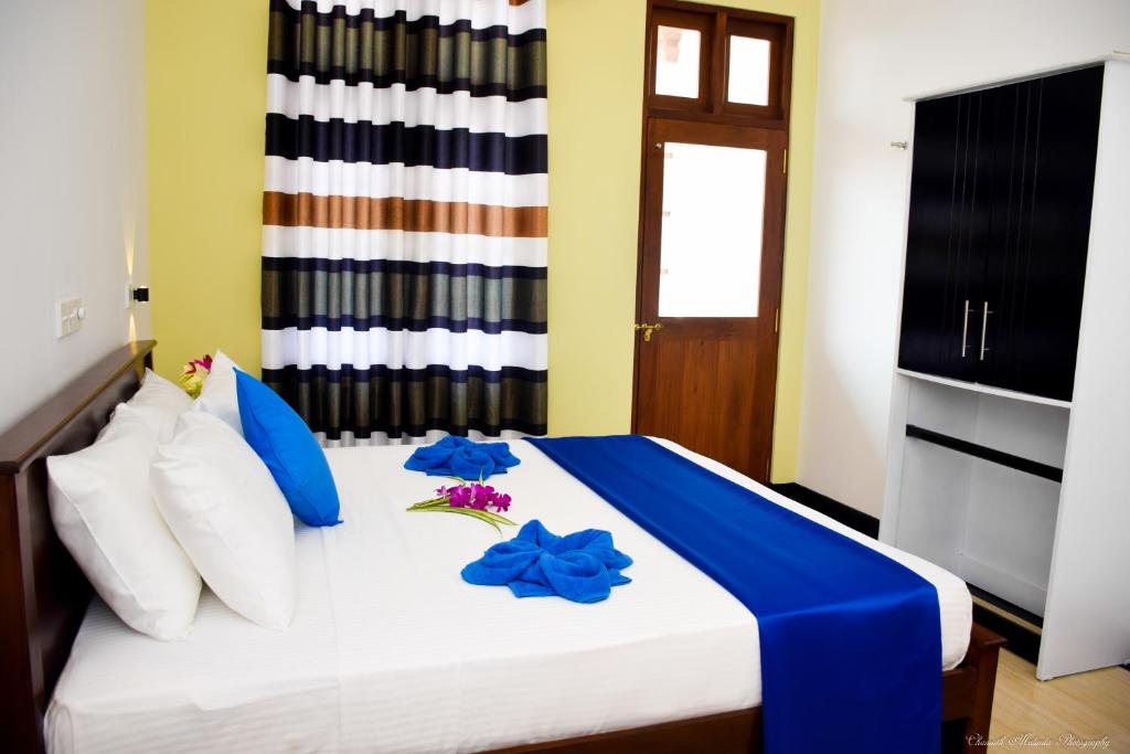 Postel nebo postele na pokoji v ubytování Tenasi Beach Resort