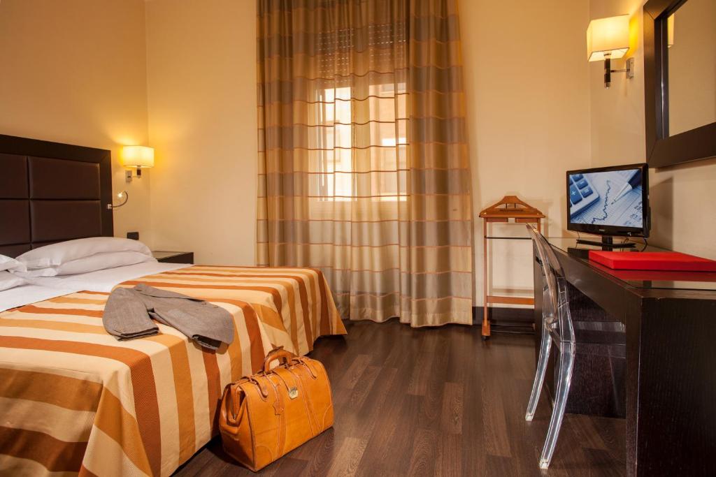 Postel nebo postele na pokoji v ubytování Hotel Buenos Aires