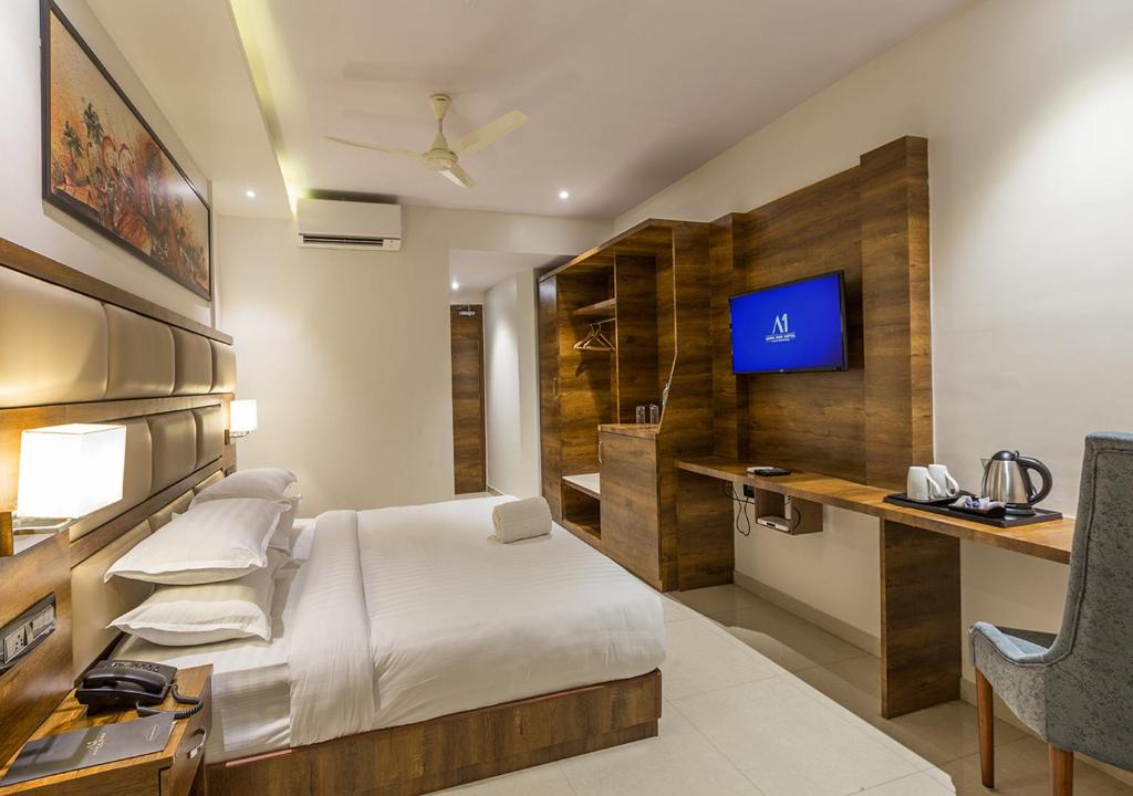 TV a/nebo společenská místnost v ubytování Aura One Hotel