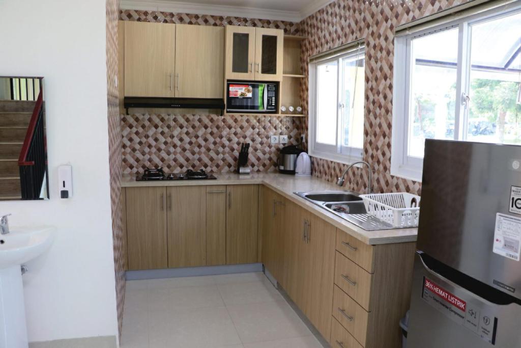 Kuchyň nebo kuchyňský kout v ubytování Diyar Villas Puncak K3/2A