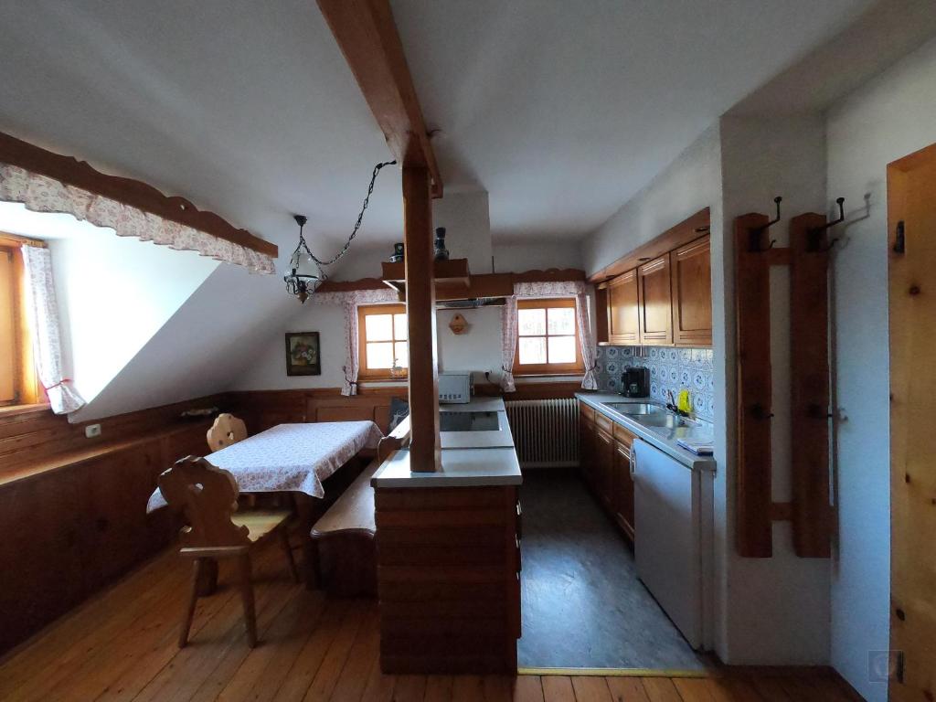 A bed or beds in a room at Alpenhaus Ganser-Dixit