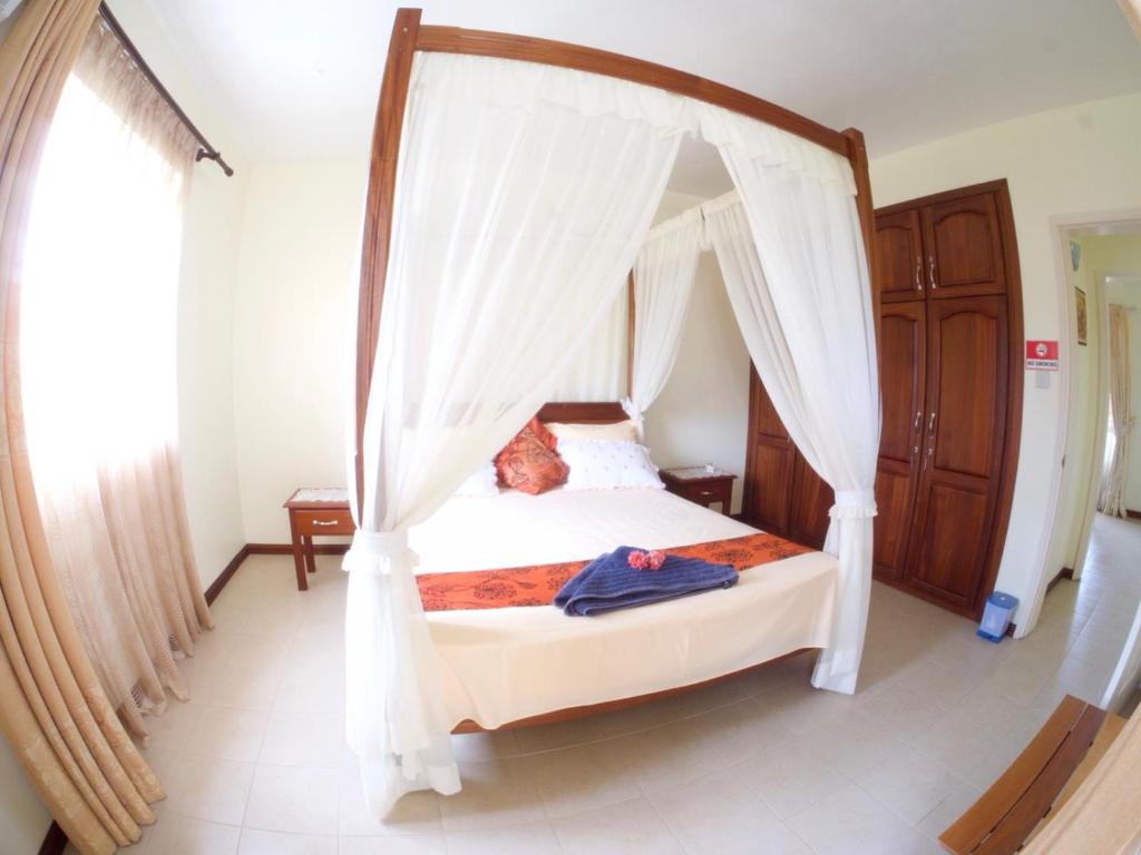 Postel nebo postele na pokoji v ubytování Azure Villa