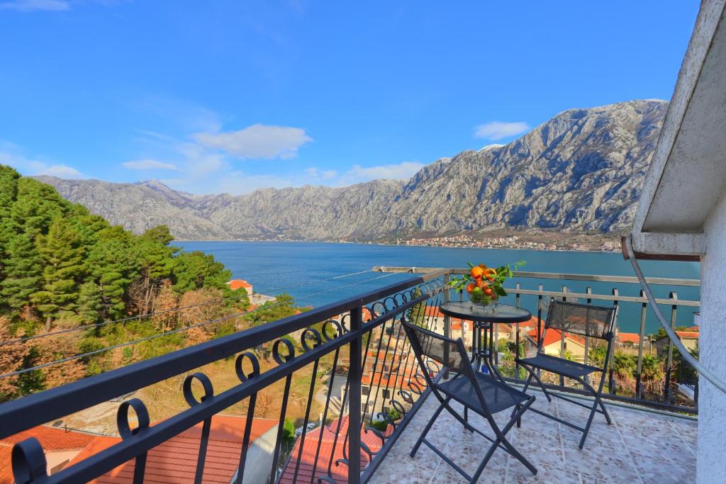 a balcony with a view of the water and mountains at Apartment Mirjana in Kotor