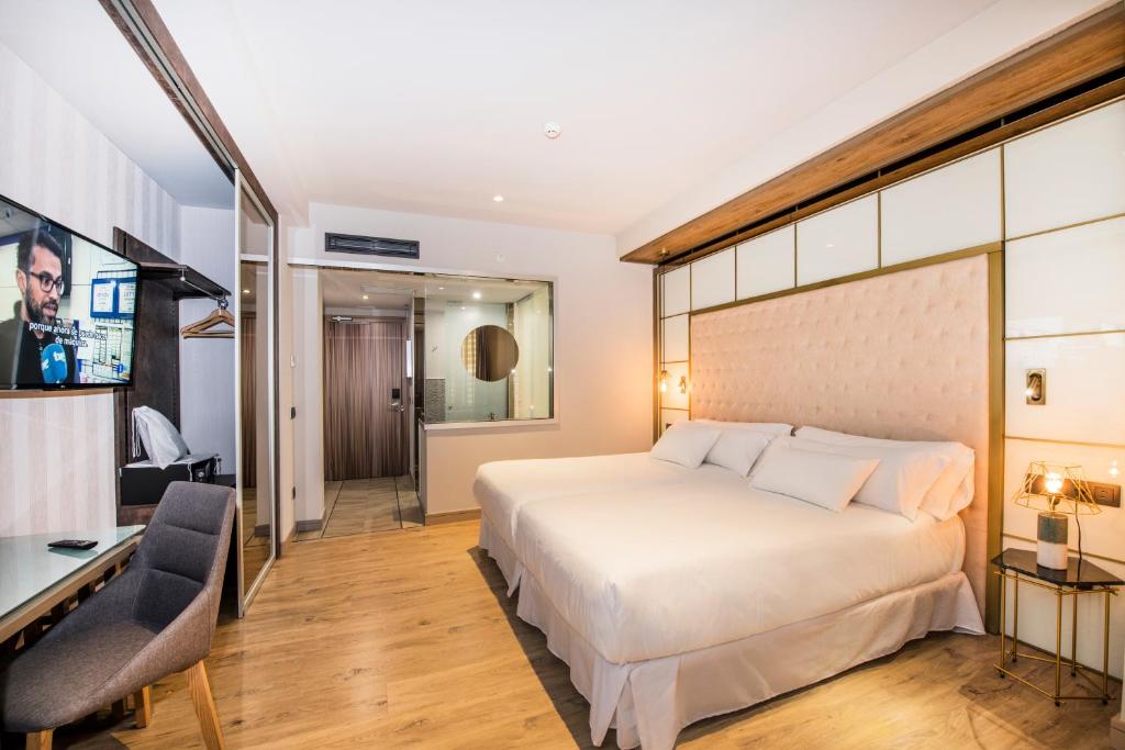 Postel nebo postele na pokoji v ubytování Barceló Ourense
