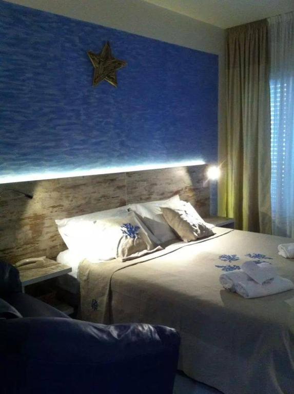Postel nebo postele na pokoji v ubytování Hotel Alba