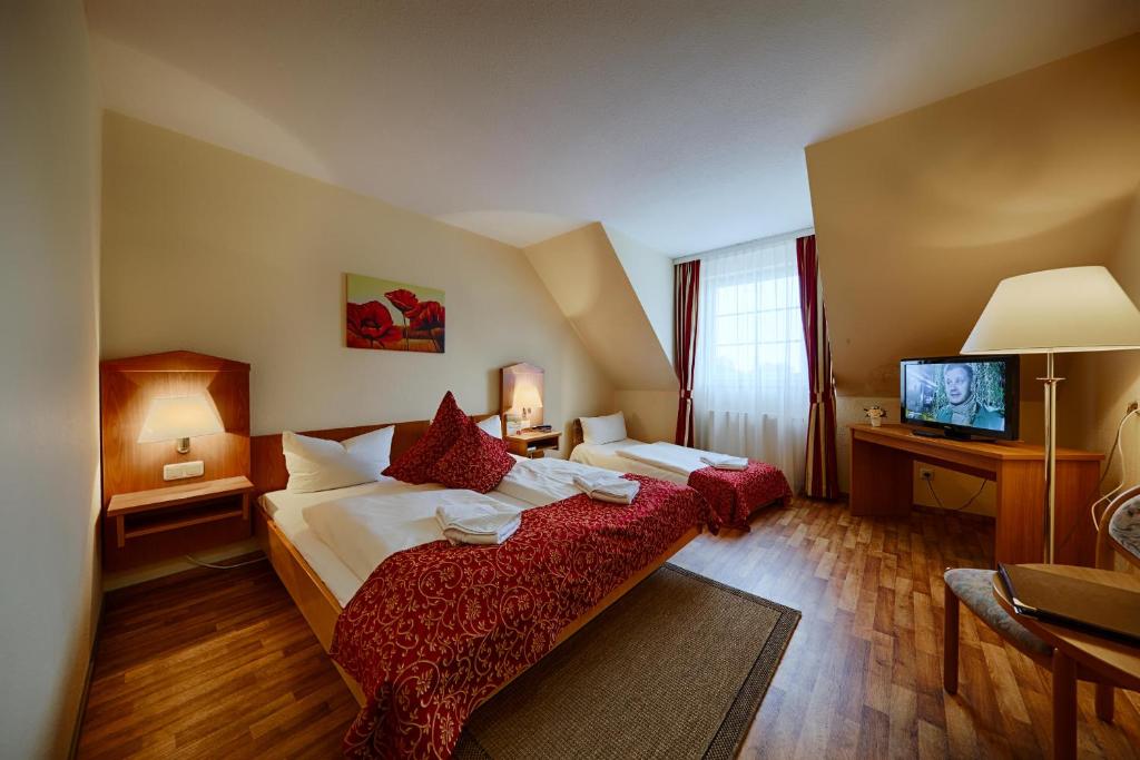 Postel nebo postele na pokoji v ubytování Hotel Auerhahn