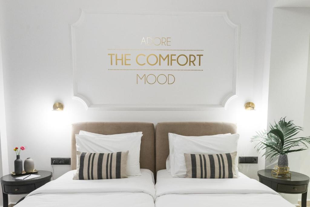 Säng eller sängar i ett rum på The Mood Luxury Rooms