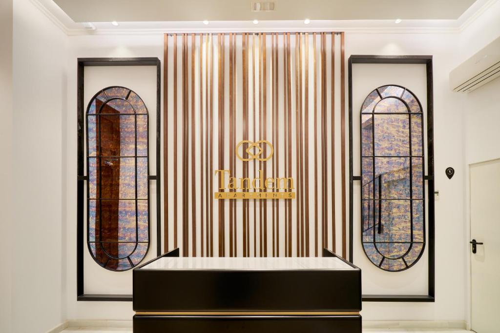 a altar in a room with two stained glass windows at Tandem Soho Suites in Málaga