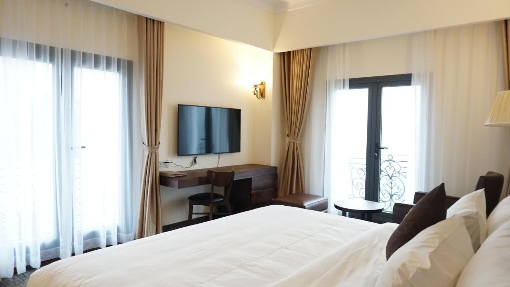 TV a/nebo společenská místnost v ubytování Phoenix Hotel Hà Giang