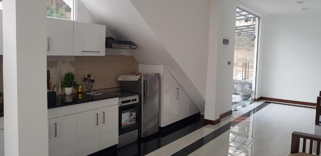 Kuchyň nebo kuchyňský kout v ubytování Fairview Residence