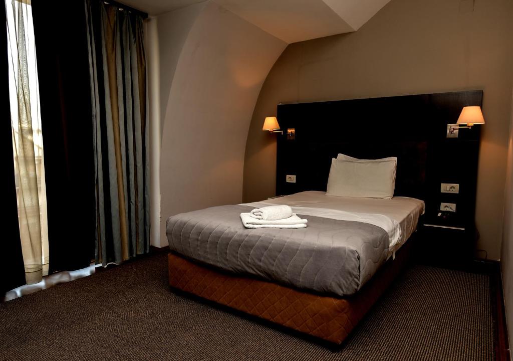 Postel nebo postele na pokoji v ubytování Hotel Dolce International