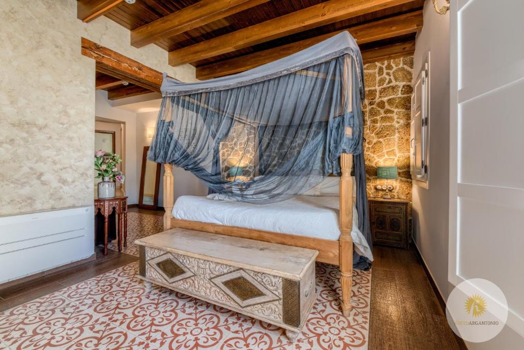 Postel nebo postele na pokoji v ubytování Hotel Argantonio