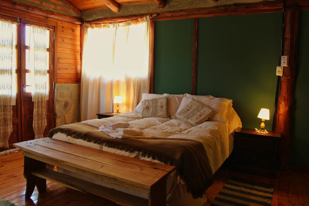 Voodi või voodid majutusasutuse Criollo Lodge toas