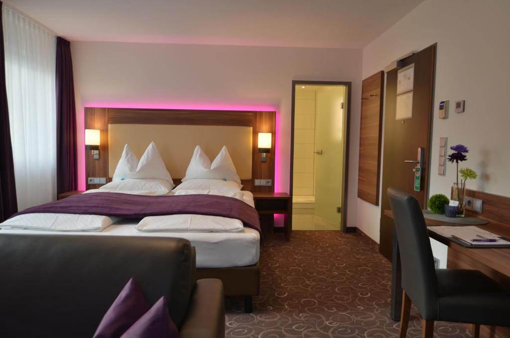 Postel nebo postele na pokoji v ubytování Wohlfühl-Hotel Neu Heidelberg