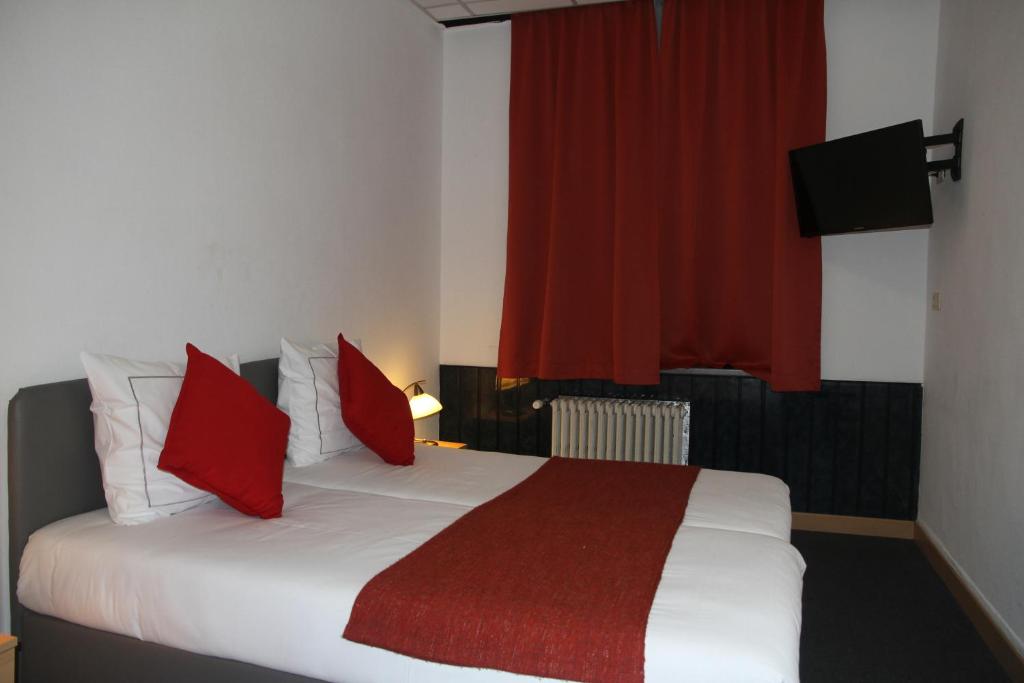 Postel nebo postele na pokoji v ubytování Hotel De Spiegel