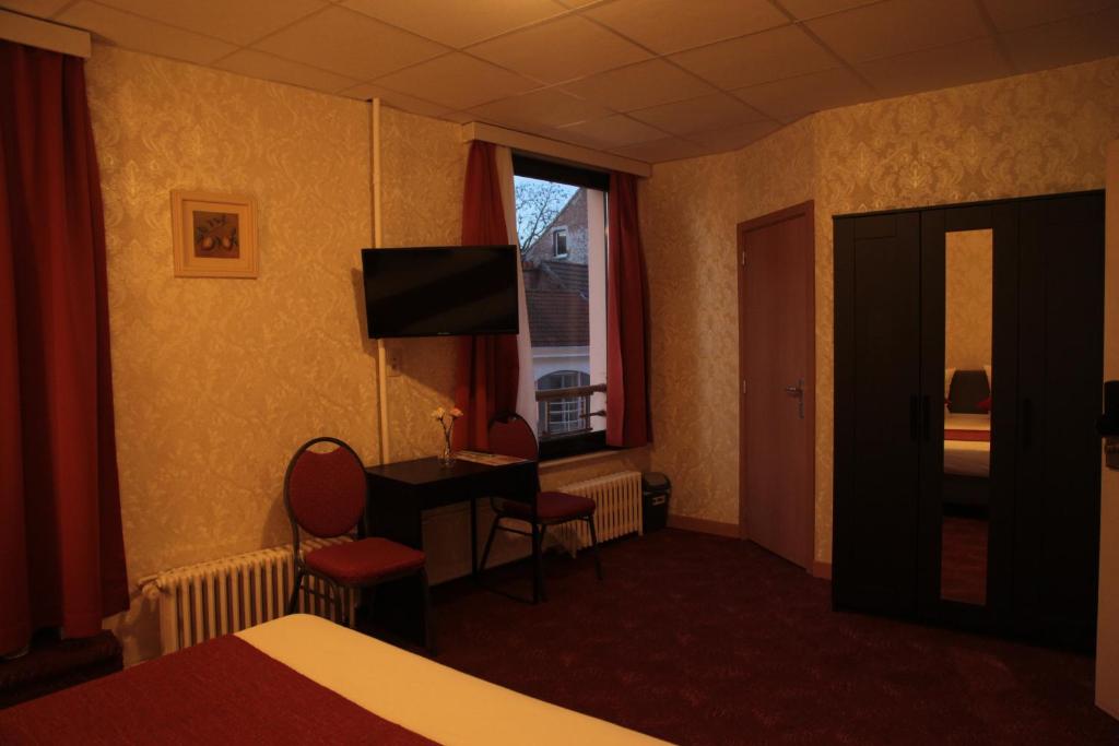 TV a/nebo společenská místnost v ubytování Hotel De Spiegel