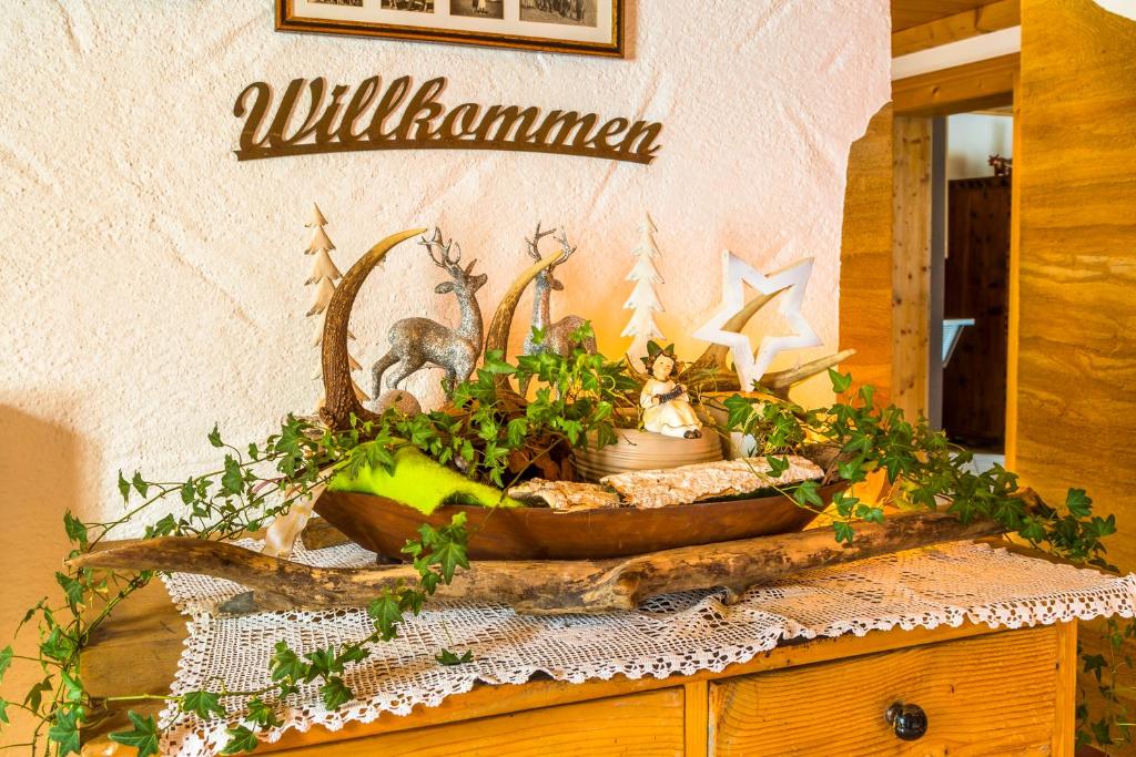 a table with a bowl of plants on it at Urbangut in Sankt Michael im Lungau