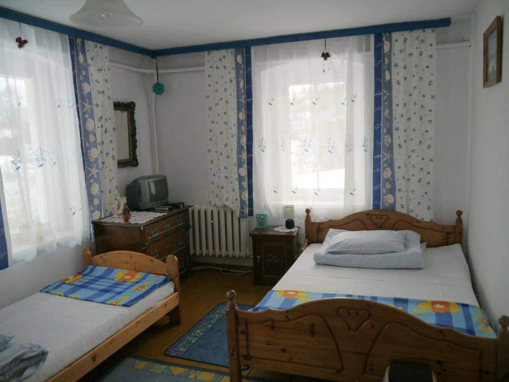 Posteľ alebo postele v izbe v ubytovaní Pod kasztanem gospodarstwo agroturystyczne
